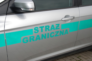 Fot. MOSG Napis &quot;Straż Graniczna&quot; na drzwiach samochodu.